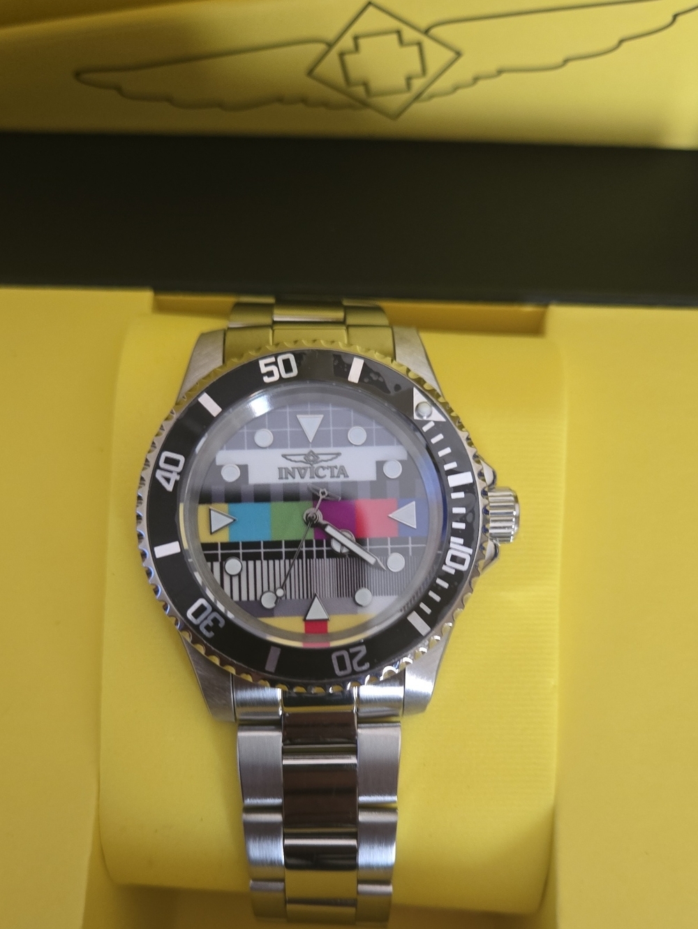Invicta Men’s Pro Diver Silver Watch with Black Bezel and Multi-Color Dial
